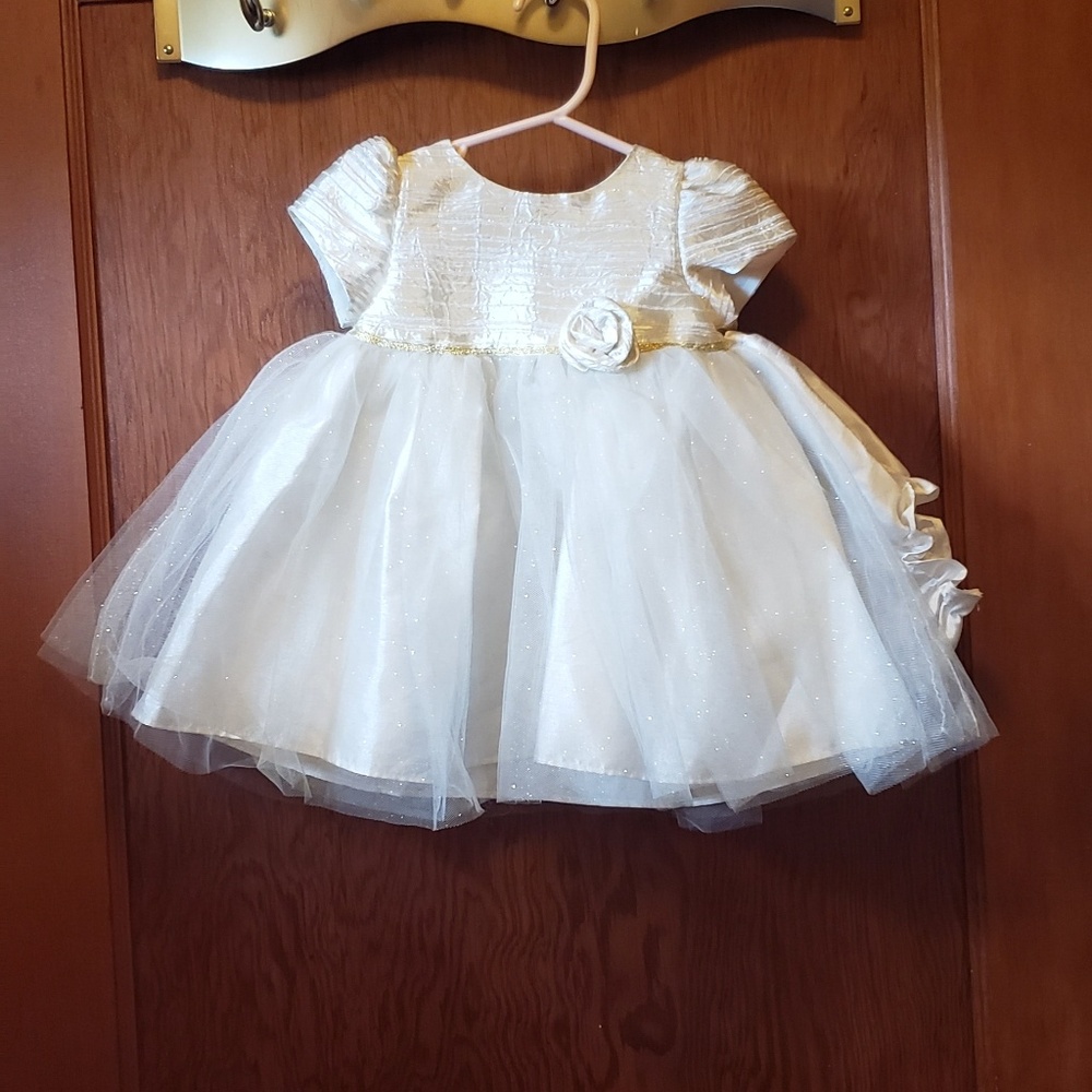 SOLD.       Baby girls gold holiday dress